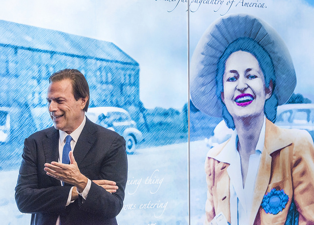 Michael Beschloss in front of the mural at the LBJ Presidential Library